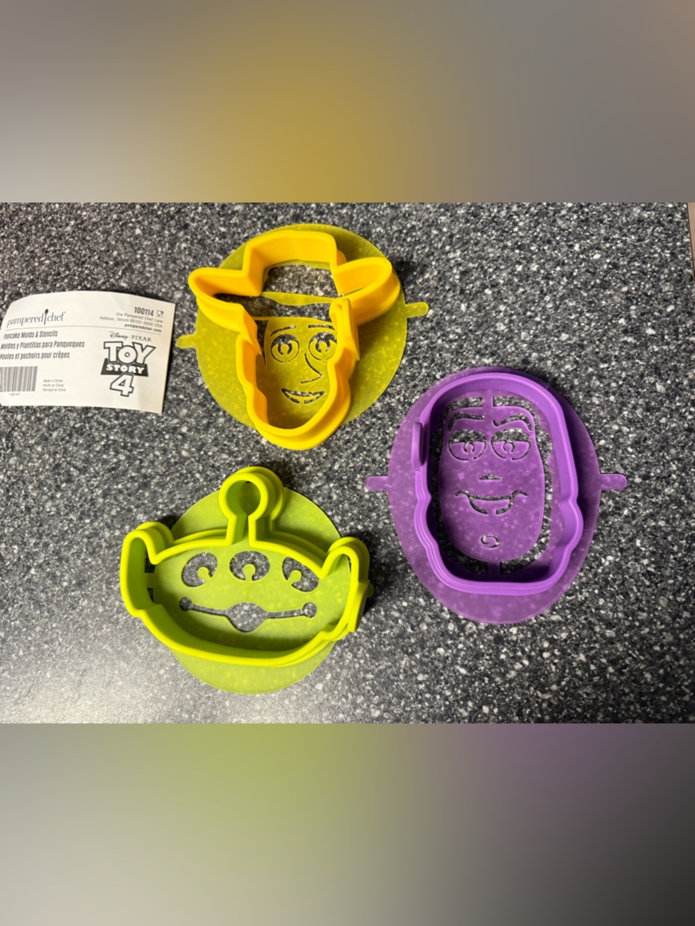 Pampered Chef Toy Story Pancake Mold Set - Yellow, Green, Purple.